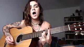 Busty Emo chick plays guitar and fingers asshole