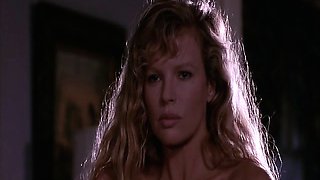 Kim Basinger in a white slip with hard nipples as she poses