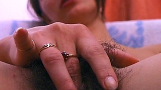 German Babe Plays with Her Hairy Pussy in Close up
