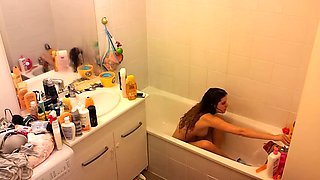 Spy camera in the bathroom captures sexy stepmom naked