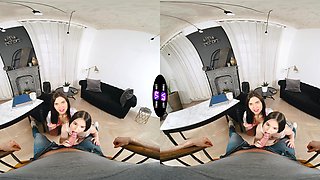 Two young girls sharing a big cock in a virtual reality scene