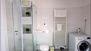 Miniskirt Lover Raver Girl Reveals Her Piercing on Her Pussy in the Bathroom by Lifting Her Short Skirt