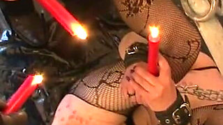 Playing with candles and her pussy