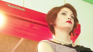 The sexy couple has sex right in the kitchen, Bree Daniels’ red hair shining.